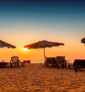 Tropical,Sunny,Beach,Party,At,Sunset,With,Sun,Umbrellas,And